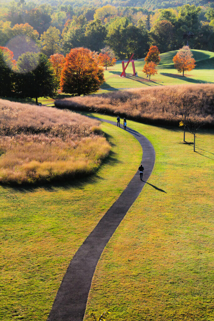 people-walking-along-the-pathway-at-Storm-King-Art-Center-in-the-Hudson-Valley-New-York-in-the-fall