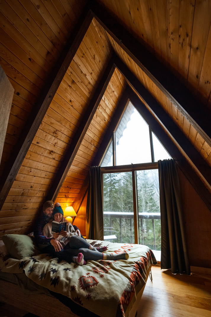 reading a book in our cozy a frame cabin in dover vermont