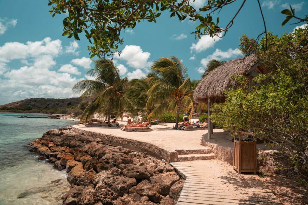 sunbeds and palapa umbrellas at Jan Thiel Beach in Curacao