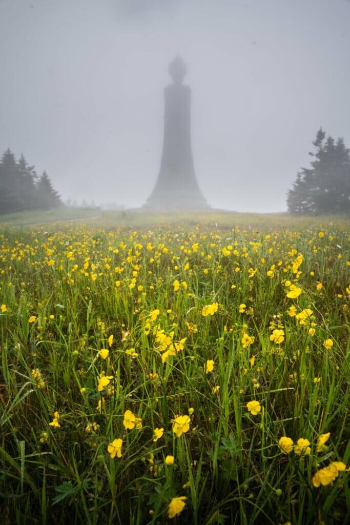 the Veterans War Memorial Tower at the top of Mount Greylock in the Berkshires Massachusetts on a rainy moody summer day