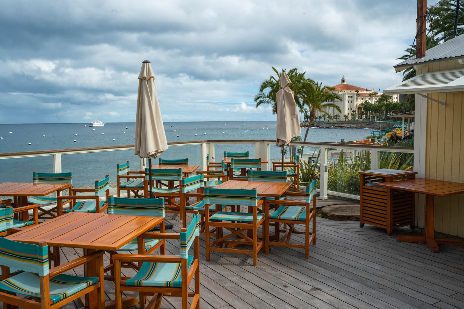 the outdoor patio and deck with casino view at Descanso Beach Club on Catalina Island in California