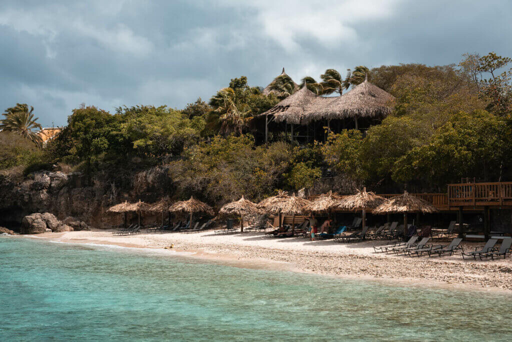 the palapa umbrellas and beach chairs at Playa Kalki in Curacao at Westpunt