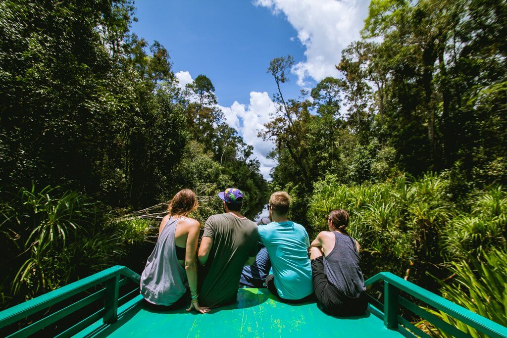 All of us hanging out looking for wildlife on the front of our boat in Borneo