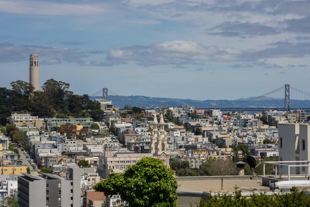 view of Coit Tower from Lombard Street in San Francisco