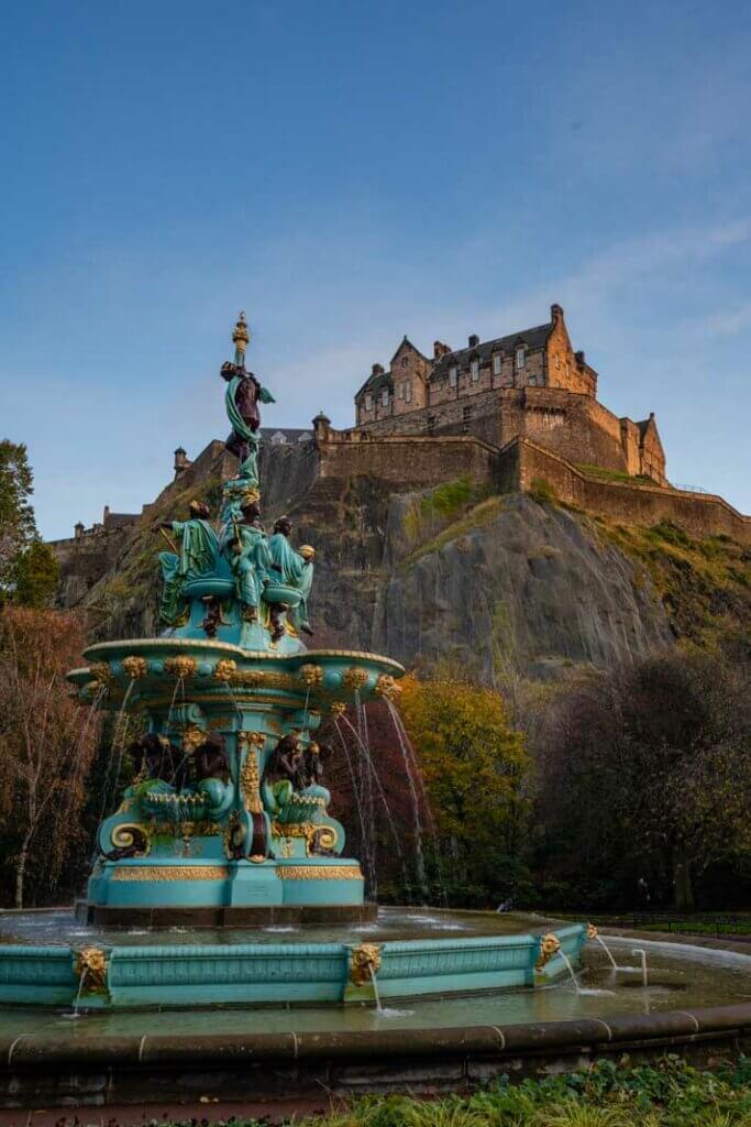 view of Edinburgh Castle from Princes Street Garden West with a view of Ross Fountain in Scotland