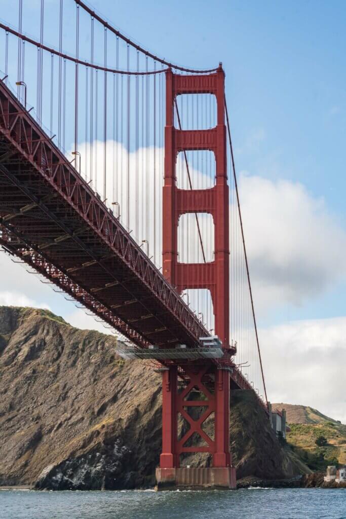 view of Golden Gate Bridge from boat tour below in San Francisco California