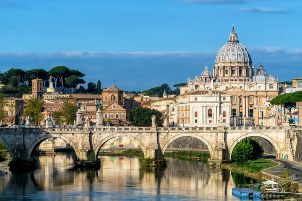 view-of-St-Peter-Basilica-of-Vatican-and-St-Angelo-Bridge-crossing-Tiber-River-in-Rome-Italy