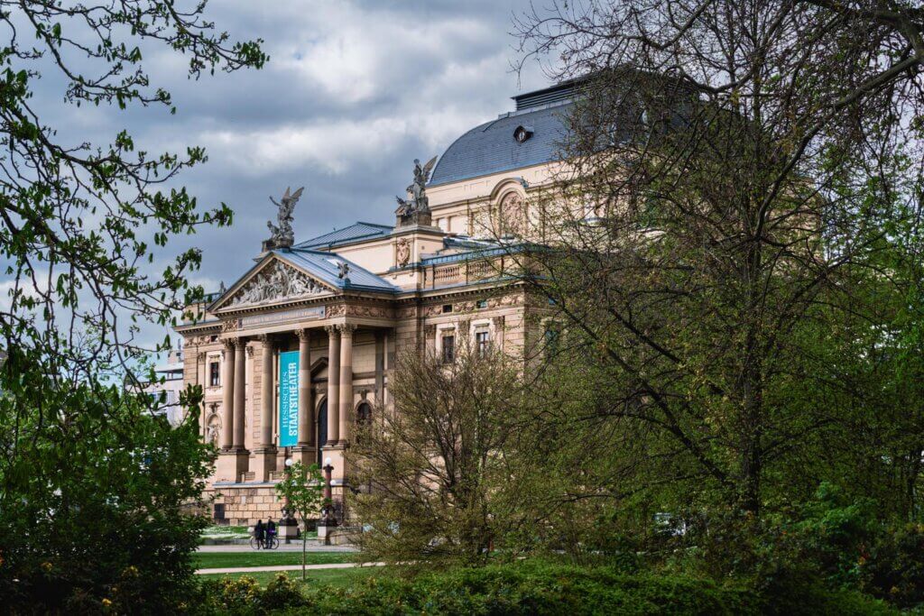 view of Staatstheater Wiesbaden from Warmer Damm Park in Germany