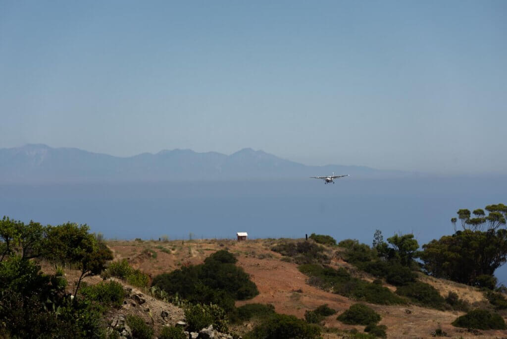 view of a plane landing at Catalina Island's Airport in the Sky