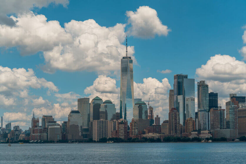 view of the Lower Manhattan skyline and World Trade Center from Liberty Island in NYC