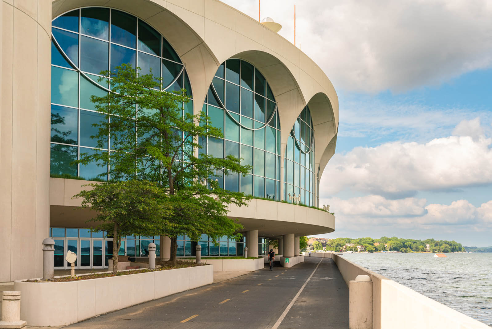view of the Monona Terrace from the Lake Monona Bike Loop path in Madison Wisconsin