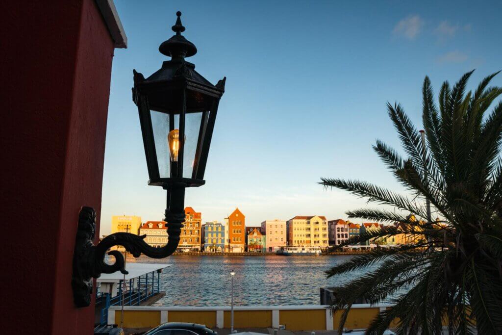 view of the colorful Handelskade buidlings in Otrabanda from Restaurant & Café Gouverneur De Rouville in Willemstad Curacao