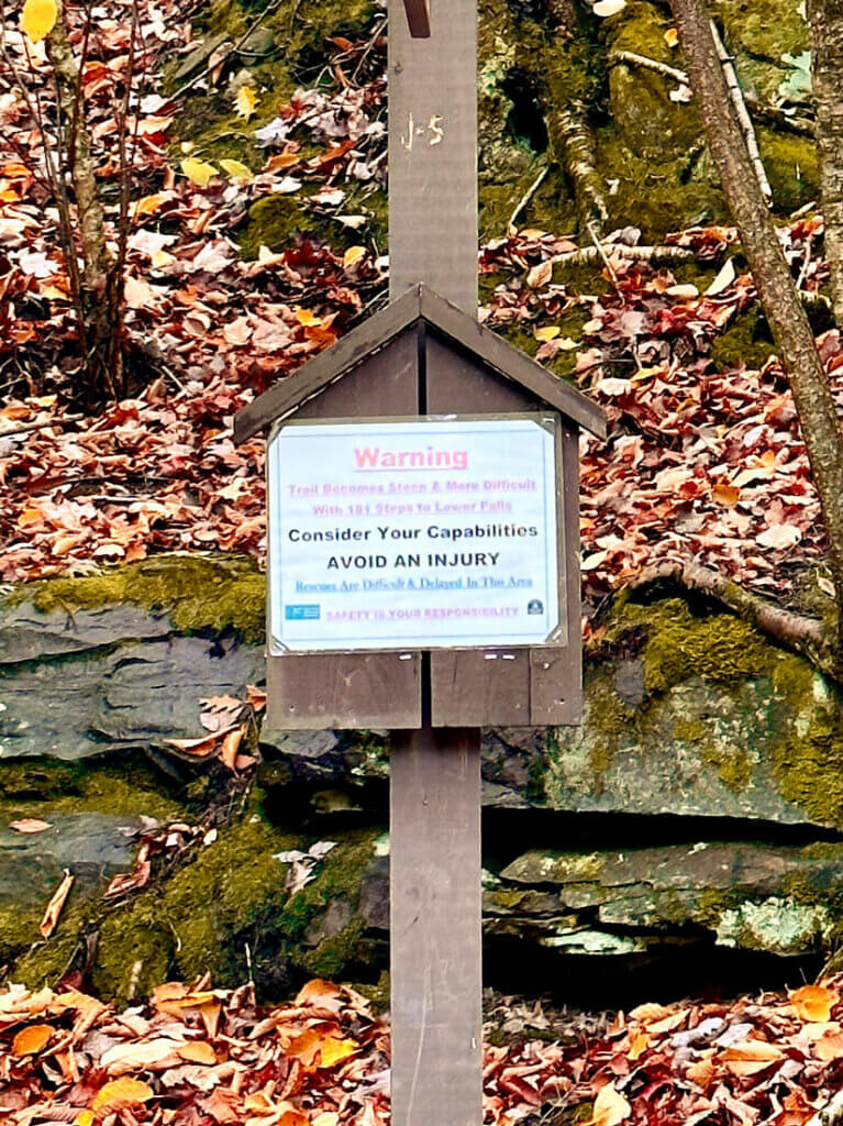 warning-sign-on-kaaterskill-falls-hike-in-catskills-ny
